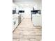Modern kitchen featuring white cabinets, stainless steel appliances, and sleek countertops at 4638 Durney St, New Port Richey, FL 34652