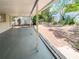 Covered patio offers a relaxing outdoor space, leading to a fenced backyard at 4638 Durney St, New Port Richey, FL 34652