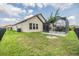 Well-maintained backyard showcases the screened patio and provides a private outdoor retreat at 4716 Butler National Dr, Wesley Chapel, FL 33543
