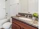 Bathroom vanity with granite countertop, vessel sink, and combined tub and shower at 4716 Butler National Dr, Wesley Chapel, FL 33543