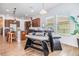 Cozy dining area with a table, built-in seating, and bright natural light from the surrounding windows at 4716 Butler National Dr, Wesley Chapel, FL 33543