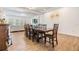 Open dining room with a large dining table with seating for eight people at 4716 Butler National Dr, Wesley Chapel, FL 33543