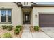 Charming front entrance features a cozy seating area and manicured landscaping at 4716 Butler National Dr, Wesley Chapel, FL 33543