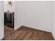A modern stainless steel washer and dryer on wood-look floors with open storage at 4716 Butler National Dr, Wesley Chapel, FL 33543