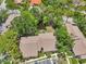 Community condos feature lake views, mature trees, and assigned parking at 4735 Winslow Beacon # 14, Sarasota, FL 34235