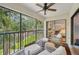Relaxing screened balcony overlooking a pond, with views into the bedroom and living space at 4735 Winslow Beacon # 14, Sarasota, FL 34235