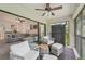 Inviting screened balcony with seating area, offering an indoor-outdoor living experience at 4735 Winslow Beacon # 14, Sarasota, FL 34235