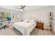 Bright bedroom features a comfortable bed, desk, and neutral decor at 4735 Winslow Beacon # 14, Sarasota, FL 34235