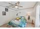 Cozy bedroom features a ceiling fan, closet, and vibrant decorations creating a fun and inviting space at 4735 Winslow Beacon # 14, Sarasota, FL 34235