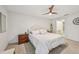 Bright bedroom features a comfortable bed, neutral decor, and great natural light at 4735 Winslow Beacon # 14, Sarasota, FL 34235