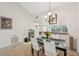 Inviting dining area with a view of the kitchen, perfect for casual meals and gatherings at 4735 Winslow Beacon # 14, Sarasota, FL 34235