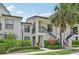 Attractive condo unit with private stair access and lush tropical landscaping at 4735 Winslow Beacon # 14, Sarasota, FL 34235