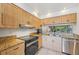 Kitchen features granite countertops and stainless steel dishwasher and oven at 4735 Winslow Beacon # 14, Sarasota, FL 34235