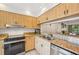 Modern kitchen featuring stainless steel appliances, granite countertops, and ample cabinet space at 4735 Winslow Beacon # 14, Sarasota, FL 34235