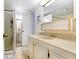 Bright bathroom featuring tile floors, a vanity with storage, and a glass-enclosed shower at 4904 Winged Foot Ave, Sarasota, FL 34234