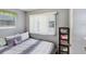 Neutral-toned bedroom with gray walls, a window with blinds, and a double bed at 4904 Winged Foot Ave, Sarasota, FL 34234