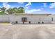 Exterior view of the clubhouse with a ramp, sign, and inviting entrance at 4904 Winged Foot Ave, Sarasota, FL 34234