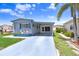 Single-story home with a covered carport and well-maintained driveway at 4904 Winged Foot Ave, Sarasota, FL 34234