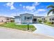 Inviting single-story home featuring a covered carport and a vibrant blue exterior at 4904 Winged Foot Ave, Sarasota, FL 34234