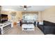 Inviting living room with comfortable sofas, neutral decor, and entertainment center at 4904 Winged Foot Ave, Sarasota, FL 34234