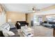Comfortable living room featuring a ceiling fan and neutral-toned walls at 4904 Winged Foot Ave, Sarasota, FL 34234