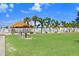 Spacious lawn and pool area with tiki hut at 4904 Winged Foot Ave, Sarasota, FL 34234