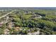 An aerial shot of residential area surrounded by lush green landscape; perfect for nature lovers at 4959 Felecity Way, Palm Harbor, FL 34685