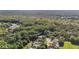 A large area of lush vegetation surrounds neighborhood homes with streams and ponds. Serene and peaceful landscape at 4959 Felecity Way, Palm Harbor, FL 34685