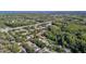 Overhead view showing the layout of houses and the surrounding green landscape, offering a sense of community at 4959 Felecity Way, Palm Harbor, FL 34685