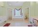 Light and airy primary bathroom with shower, soaking tub and dual vanities at 4959 Felecity Way, Palm Harbor, FL 34685