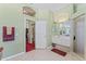 Light and airy primary bathroom with shower, vanity and neutral tile flooring at 4959 Felecity Way, Palm Harbor, FL 34685