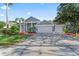 Beautiful two-story home with a three car garage and a luscious green front lawn at 4959 Felecity Way, Palm Harbor, FL 34685