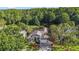 A well-maintained single Gathering home shows its front exterior complete with a yard and mature trees at 4959 Felecity Way, Palm Harbor, FL 34685