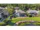 The back of the house features a screened pool with a picturesque pond view, perfect for relaxing outdoors at 4959 Felecity Way, Palm Harbor, FL 34685