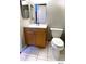 Bathroom featuring light wood vanity and white tiled floors at 5203 Oak Charter Ct # 5203, Temple Terrace, FL 33617
