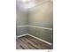 Bedroom featuring wood floors, gray walls and white trim at 5203 Oak Charter Ct # 5203, Temple Terrace, FL 33617