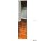 This closet features wood-look floors and louvered doors at 5203 Oak Charter Ct # 5203, Temple Terrace, FL 33617
