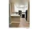 Modern kitchen featuring white cabinets, stainless steel appliances, and a light countertop at 5203 Oak Charter Ct # 5203, Temple Terrace, FL 33617