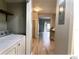 Bright laundry room features a modern washer and dryer, with neutral walls and wood-look floors at 5203 Oak Charter Ct # 5203, Temple Terrace, FL 33617
