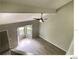 Upstairs view of the living room featuring wood-look floors and a ceiling fan at 5203 Oak Charter Ct # 5203, Temple Terrace, FL 33617