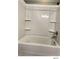 This shower/tub combo features built-in shelves at 5203 Oak Charter Ct # 5203, Temple Terrace, FL 33617