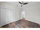 Bedroom features hardwood floors, a closet, a ceiling fan and easy access to other rooms at 5701 N 20Th St, Tampa, FL 33610