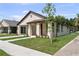 Charming single-story home with brick exterior, covered porch, and a well-maintained lawn at 5701 N 20Th St, Tampa, FL 33610