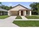 Charming single-story home boasting a well-manicured lawn, covered entrance, and freshly painted exterior at 5701 N 20Th St, Tampa, FL 33610