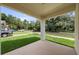 Inviting front porch offering a glimpse of the neighborhood and lush green lawn at 5701 N 20Th St, Tampa, FL 33610