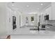 The kitchen features stainless appliances, white cabinets, and a breakfast bar at 5701 N 20Th St, Tampa, FL 33610