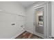 Laundry room with wire shelving and access to the outside via a glass door at 5701 N 20Th St, Tampa, FL 33610