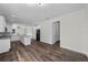 Open floorplan with hardwood flooring connecting the living room and kitchen at 5701 N 20Th St, Tampa, FL 33610