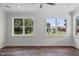 Bright living area with large windows providing ample natural light and views of the surrounding neighborhood at 5701 N 20Th St, Tampa, FL 33610