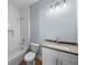 Bathroom with a tub, tile surround, modern vanity, and tiled niche at 5703 N 20Th St, Tampa, FL 33610